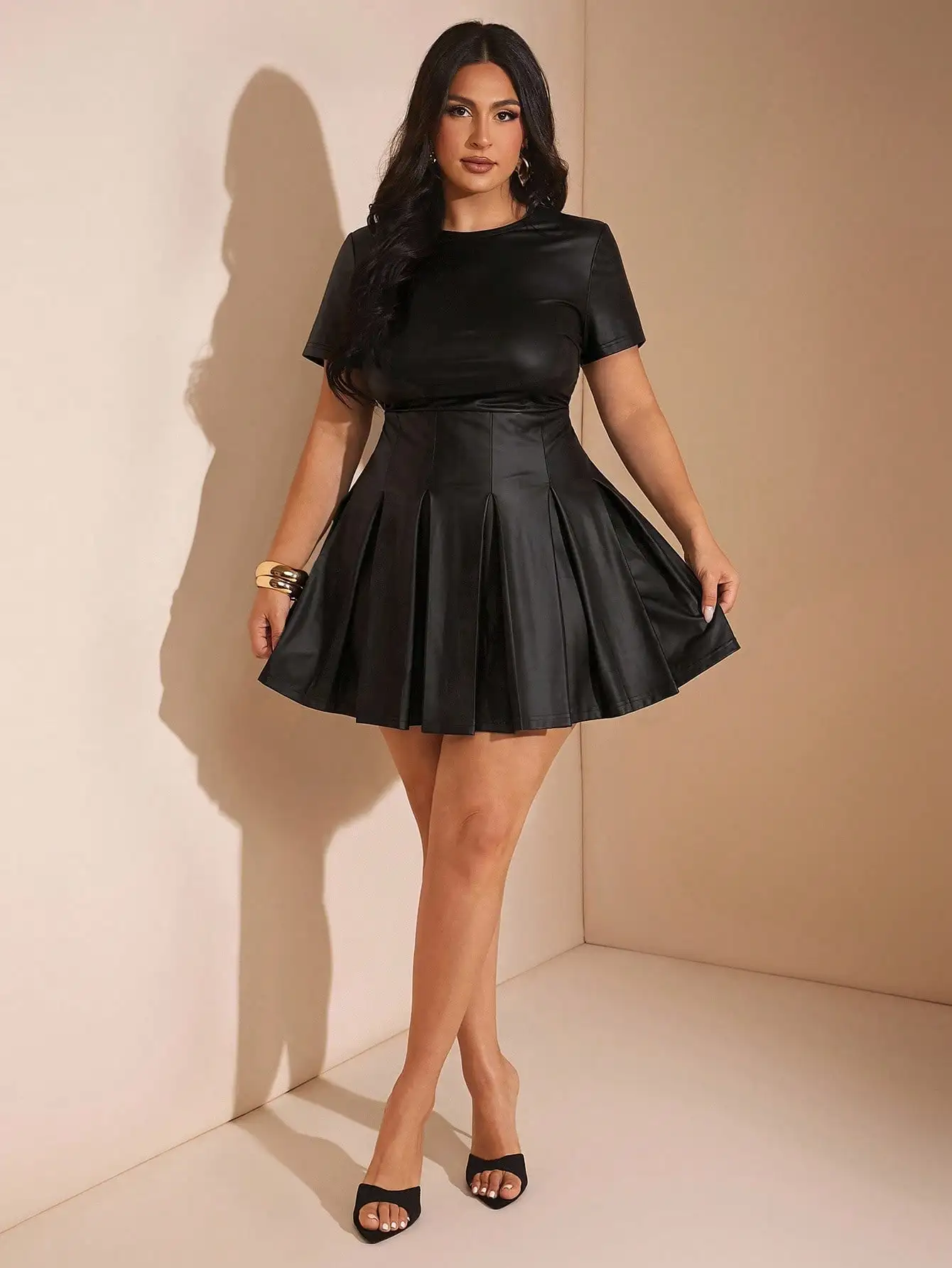 Black Faux Leather Pleated Mini Dress with Short Sleeves and Round Neck
Black Faux Leather Pleated Mini Dress with Short Sleeves and Round Neck