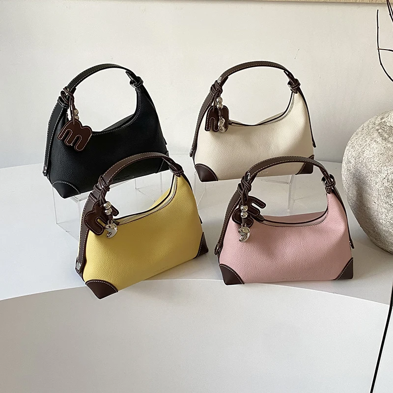 Sophisticated, minimalist, single-shoulder bag with armhole design, 2026 new model, perfect for work, stylish, perfect for going
Sophisticated, minimalist, single-shoulder bag with armhole design, 2026 new model, perfect for work, stylish, perfect for going