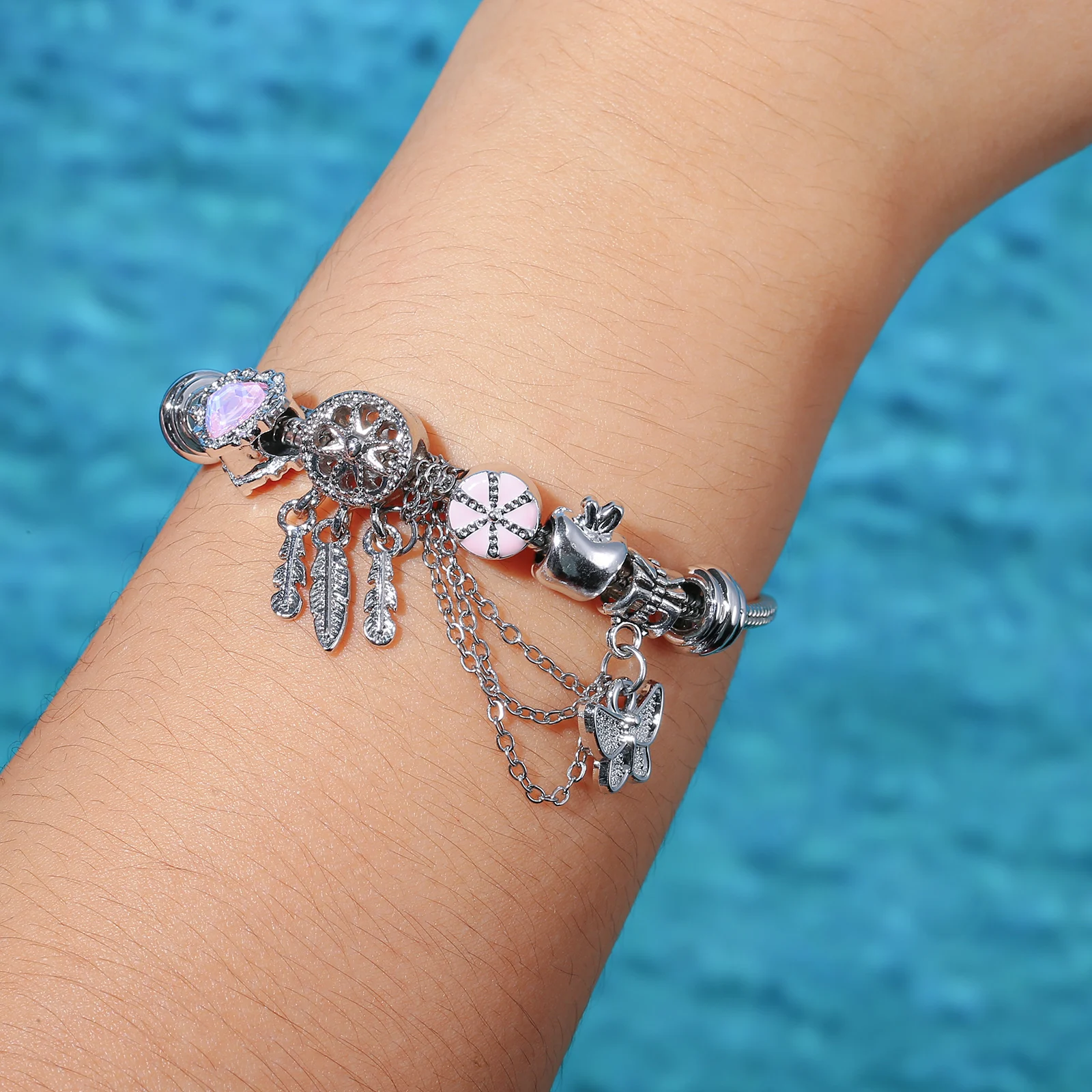 Silvery Stainless Steel Dreamcatcher Charm Bracelet with Pink Heart and Flower Pendants for Women
Silvery Stainless Steel Dreamcatcher Charm Bracelet with Pink Heart and Flower Pendants for Women