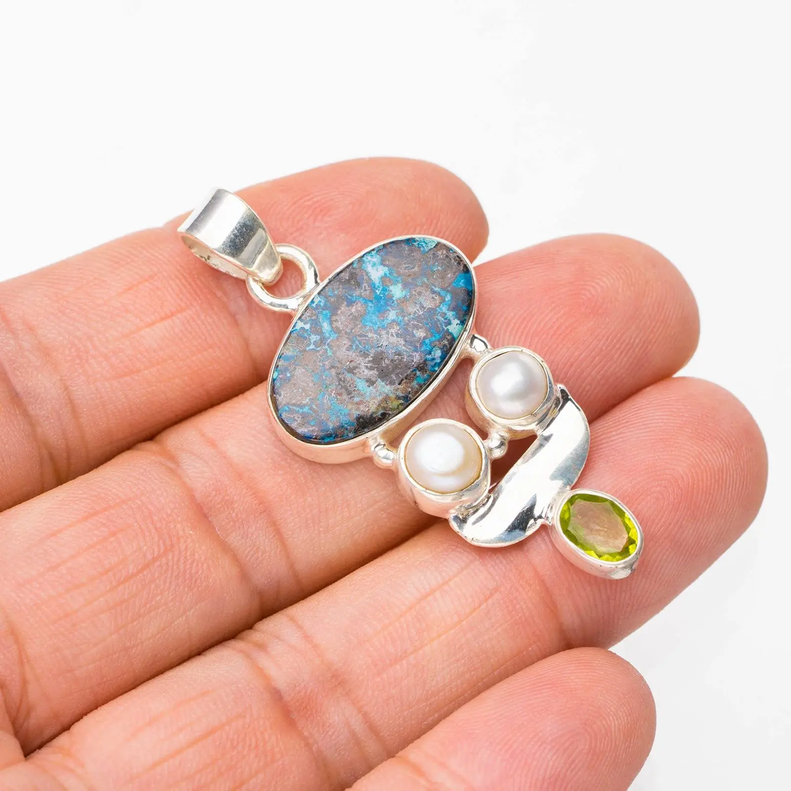 StarGems® Natural Chrysocolla River Pearl And Peridot Handmade 925 Sterling Silver Pendant 1.75" E4611
StarGems® Natural Chrysocolla River Pearl And Peridot Handmade 925 Sterling Silver Pendant 1.75" E4611