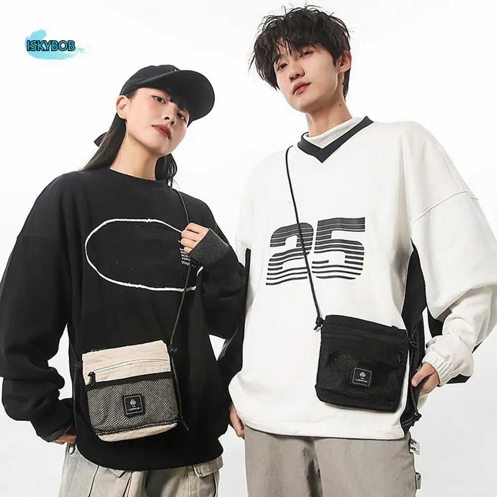 Multifunctional Crossbody Phone Pouch Sports Korean Style Nylon Shoulder Bag Solid Color Handbag Small Square Bag Unisex
Multifunctional Crossbody Phone Pouch Sports Korean Style Nylon Shoulder Bag Solid Color Handbag Small Square Bag Unisex