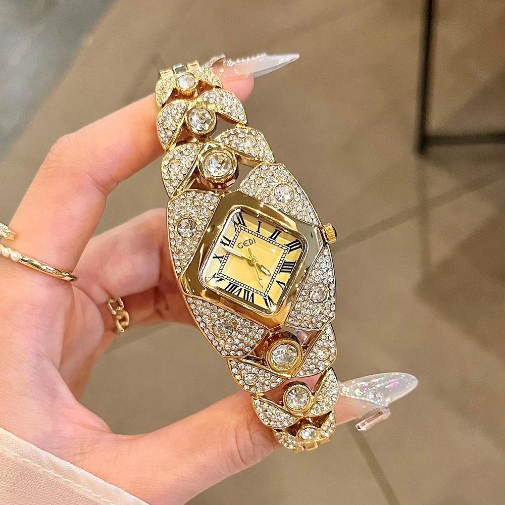 Часы GEDI, роскошные женские часы с квадратным римским циферблатом, модный блестящий браслет с бриллиантами, элегантные кварцевые женские золотые часы, подарки
Часы GEDI, роскошные женские часы с квадратным римским циферблатом, модный блестящий браслет с бриллиантами, элегантные кварцевые женские золотые часы, подарки
