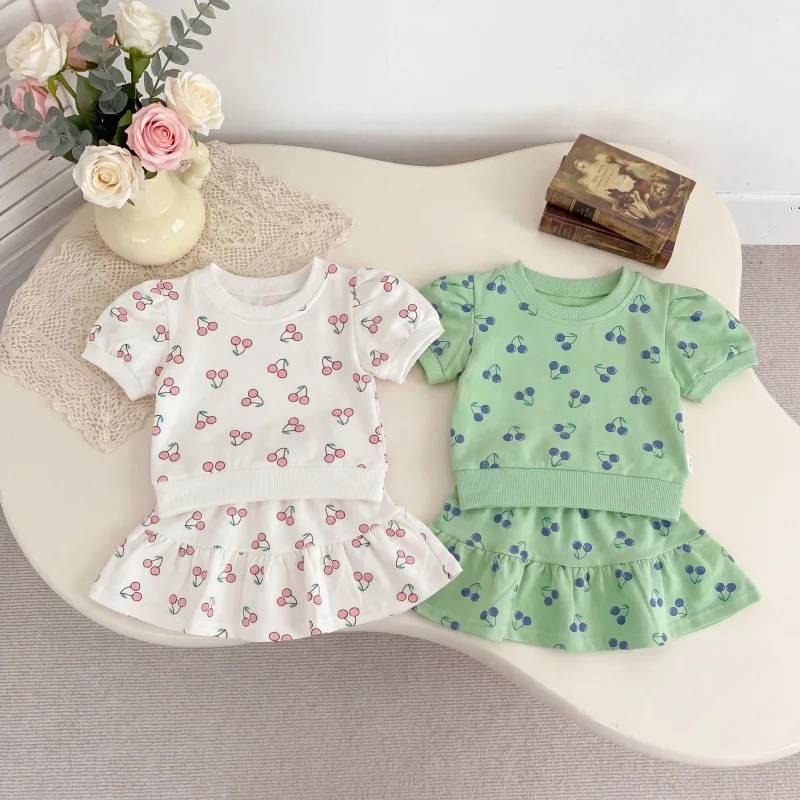 2026 Summer New Girls Short Sleeve Clothes Set Baby Girl Cute Cherry Print T Shirts + Skirts 2pcs Suit Toddler Cotton Outfits
2026 Summer New Girls Short Sleeve Clothes Set Baby Girl Cute Cherry Print T Shirts + Skirts 2pcs Suit Toddler Cotton Outfits