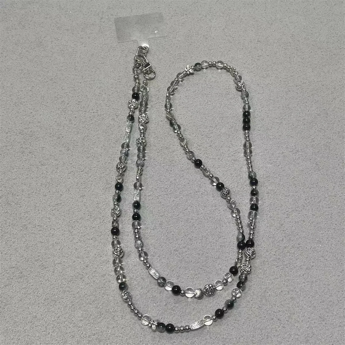 Black And White Mobile Phone Strap Long Crossbody Backable Retro Pendant High End Anti Loss Pendant
Black And White Mobile Phone Strap Long Crossbody Backable Retro Pendant High End Anti Loss Pendant
