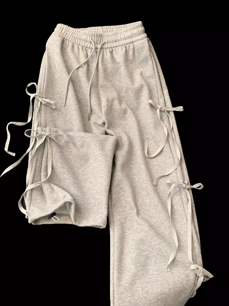 Spring New Casual Solid Ruffle Pants Women Design Sense Bow Lace Up Baggy Pant Female Korean Loose Solid Slimming Sweat Pants
Spring New Casual Solid Ruffle Pants Women Design Sense Bow Lace Up Baggy Pant Female Korean Loose Solid Slimming Sweat Pants