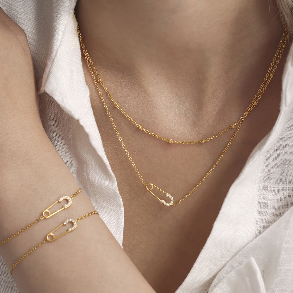 Stainless Steel Women's Jewelry 18K PVD Gold Plated Satellite Chain 2025 Trend Zircon Safety Pin Charm Necklace and Bracelet 
Stainless Steel Women's Jewelry 18K PVD Gold Plated Satellite Chain 2025 Trend Zircon Safety Pin Charm Necklace and Bracelet