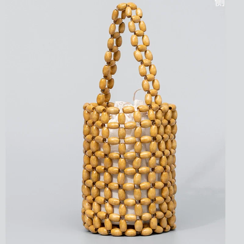 Simple Design Handmade Woven Women Bag Fashion Bucket Bag High-quality Wooden Bead Women Handbag
Simple Design Handmade Woven Women Bag Fashion Bucket Bag High-quality Wooden Bead Women Handbag