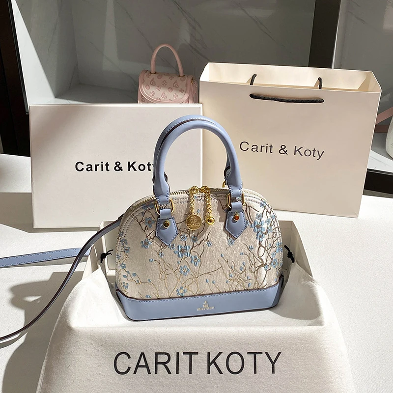 Chinese-style heavy embroidery shell bag with a high-end feel and contrasting colors handbag
Chinese-style heavy embroidery shell bag with a high-end feel and contrasting colors handbag