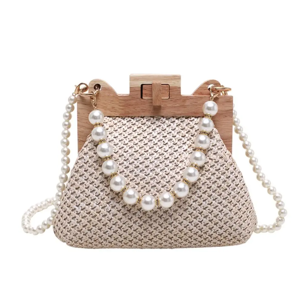 Fashion Weave Straw Shoulder Bag Wooden Top Clip Pearl Chain Handle Female Handbag Crossbody Bag Summer
Fashion Weave Straw Shoulder Bag Wooden Top Clip Pearl Chain Handle Female Handbag Crossbody Bag Summer