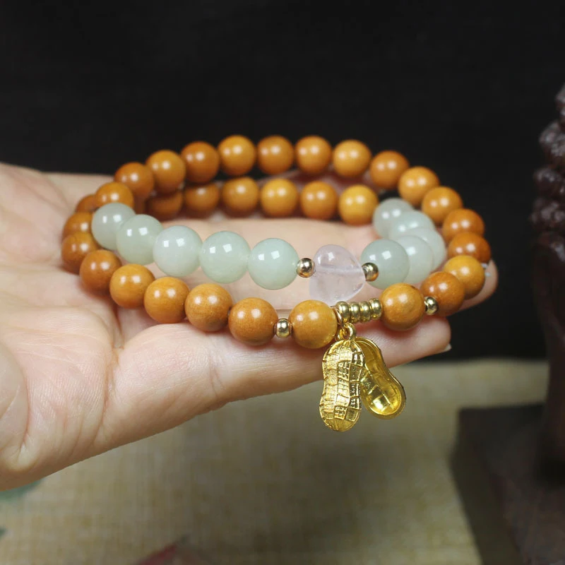 Sandalwood 8mm Double-Layer Bracelet with Golden Peanut Pendant, Women's Forest Style Buddhist Bead Jewelry
Sandalwood 8mm Double-Layer Bracelet with Golden Peanut Pendant, Women's Forest Style Buddhist Bead Jewelry