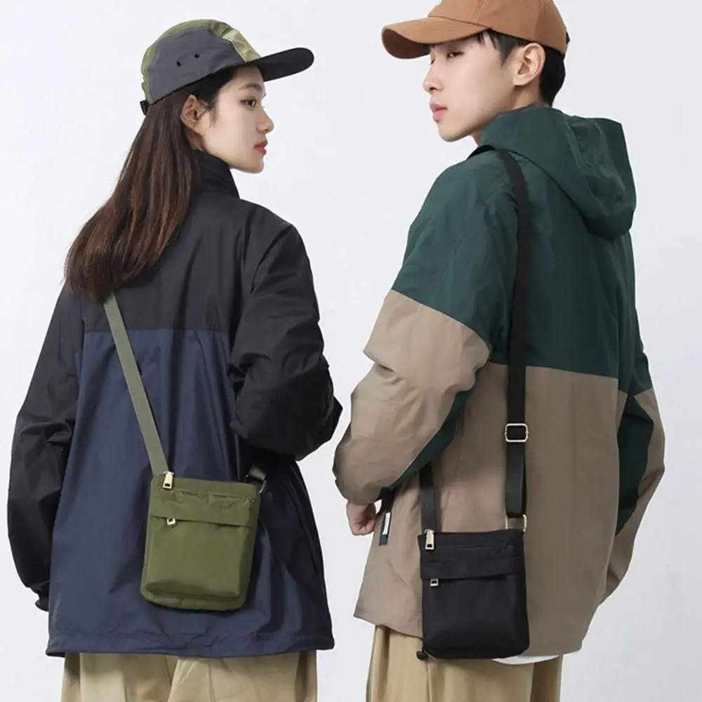 Multifunctional Crossbody Phone Pouch Korean Style Street Style Nylon Shoulder Bag Handheld Solid Color Men Square Bag Outdoor
Multifunctional Crossbody Phone Pouch Korean Style Street Style Nylon Shoulder Bag Handheld Solid Color Men Square Bag Outdoor
