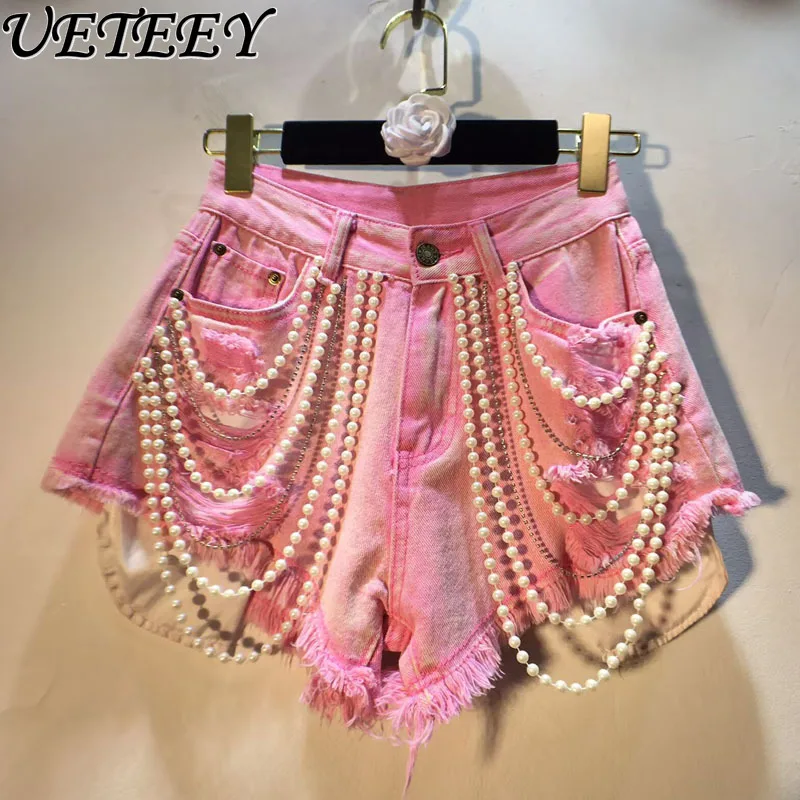 Новые летние рваные джинсовые шорты ручной работы с жемчужной цепочкой и высокой талией для похудения, женские однотонные короткие джинсы, шорты
Новые летние рваные джинсовые шорты ручной работы с жемчужной цепочкой и высокой талией для похудения, женские однотонные короткие джинсы, шорты