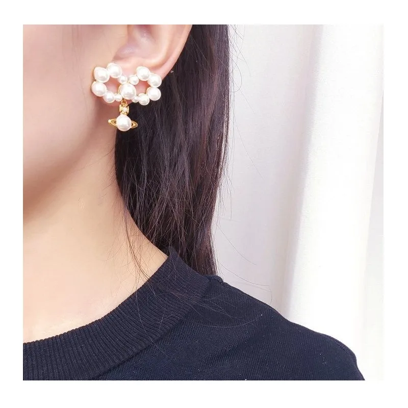 Accessories Fashion Pearl Embellishment Bow Shape Three-dimensional Planet Pendant Sweet Cool Wind Earrings
Accessories Fashion Pearl Embellishment Bow Shape Three-dimensional Planet Pendant Sweet Cool Wind Earrings