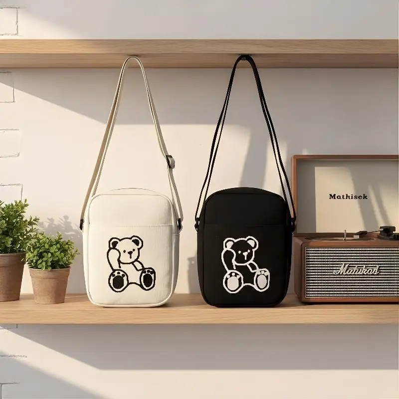 Mini Bear Embroidered Canvas Crossbody Bag for Women Small Shoulder Purse Casual Outing Lightweight Trendy Messenger Bag
Mini Bear Embroidered Canvas Crossbody Bag for Women Small Shoulder Purse Casual Outing Lightweight Trendy Messenger Bag