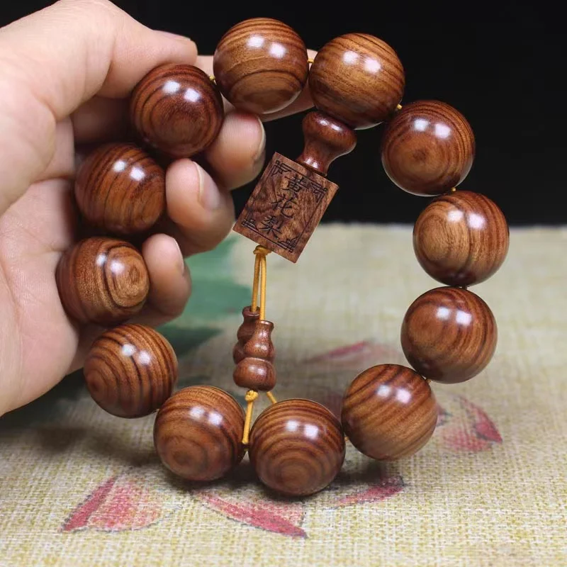 Hainan Natural Log Big Leaf Yellow Pear Handheld Rosary Bracelet Purple Oil Men and Women Popular Crafts Ornament
Hainan Natural Log Big Leaf Yellow Pear Handheld Rosary Bracelet Purple Oil Men and Women Popular Crafts Ornament