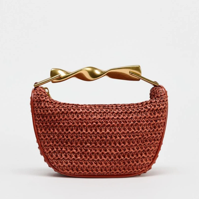 Mini Braided Bag With A braided Body. Metallic Gold Top Handle And A Double Adjustable And Removable Crossbody Strap Zip Closure
Mini Braided Bag With A braided Body. Metallic Gold Top Handle And A Double Adjustable And Removable Crossbody Strap Zip Closure