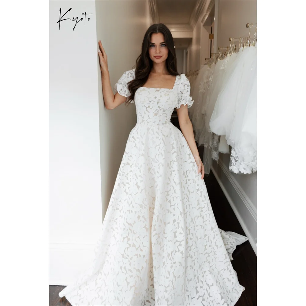Свадебное платье Kyoto с индивидуальным дизайном, белое, с квадратным вырезом, короткими рукавами, кружевное, фасон А-силуэт, со шлейфом, вечернее платье 2026
Свадебное платье Kyoto с индивидуальным дизайном, белое, с квадратным вырезом, короткими рукавами, кружевное, фасон А-силуэт, со шлейфом, вечернее платье 2026