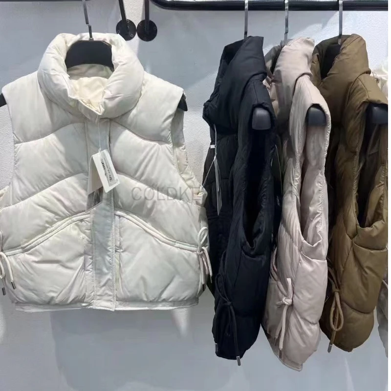 Пуховые хлопковые пальто, женский жилет, новинка 2025, модный жилет без рукавов, осенне-зимний белый жилет, теплая куртка, женский жилет
Пуховые хлопковые пальто, женский жилет, новинка 2025, модный жилет без рукавов, осенне-зимний белый жилет, теплая куртка, женский жилет