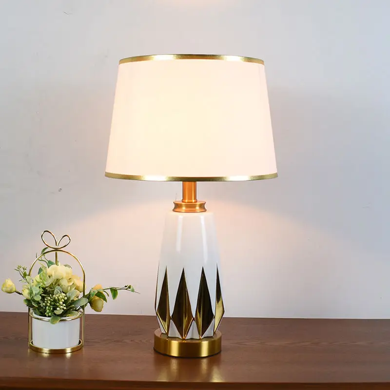 Simple household bedroom table lamp cross-border light luxury bedside lamp ceramic gold-painted ornament decoration LED ambient
Simple household bedroom table lamp cross-border light luxury bedside lamp ceramic gold-painted ornament decoration LED ambient