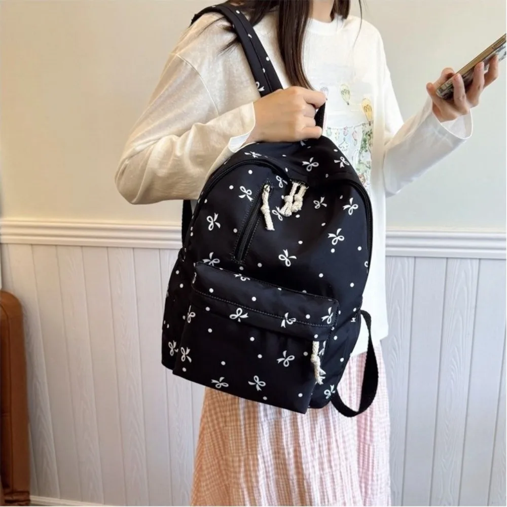 Cute Multi-Pocket Bow Print Backpack Adjustable Straps Large Capacity Students Backpack Nylon Book Bag Daily Use
Cute Multi-Pocket Bow Print Backpack Adjustable Straps Large Capacity Students Backpack Nylon Book Bag Daily Use