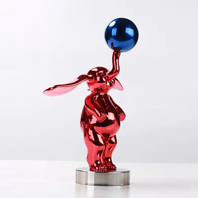 Modern simple resin ear electroplated small flying elephant playing ball cartoon sculpture model room desktop decoration
Modern simple resin ear electroplated small flying elephant playing ball cartoon sculpture model room desktop decoration
