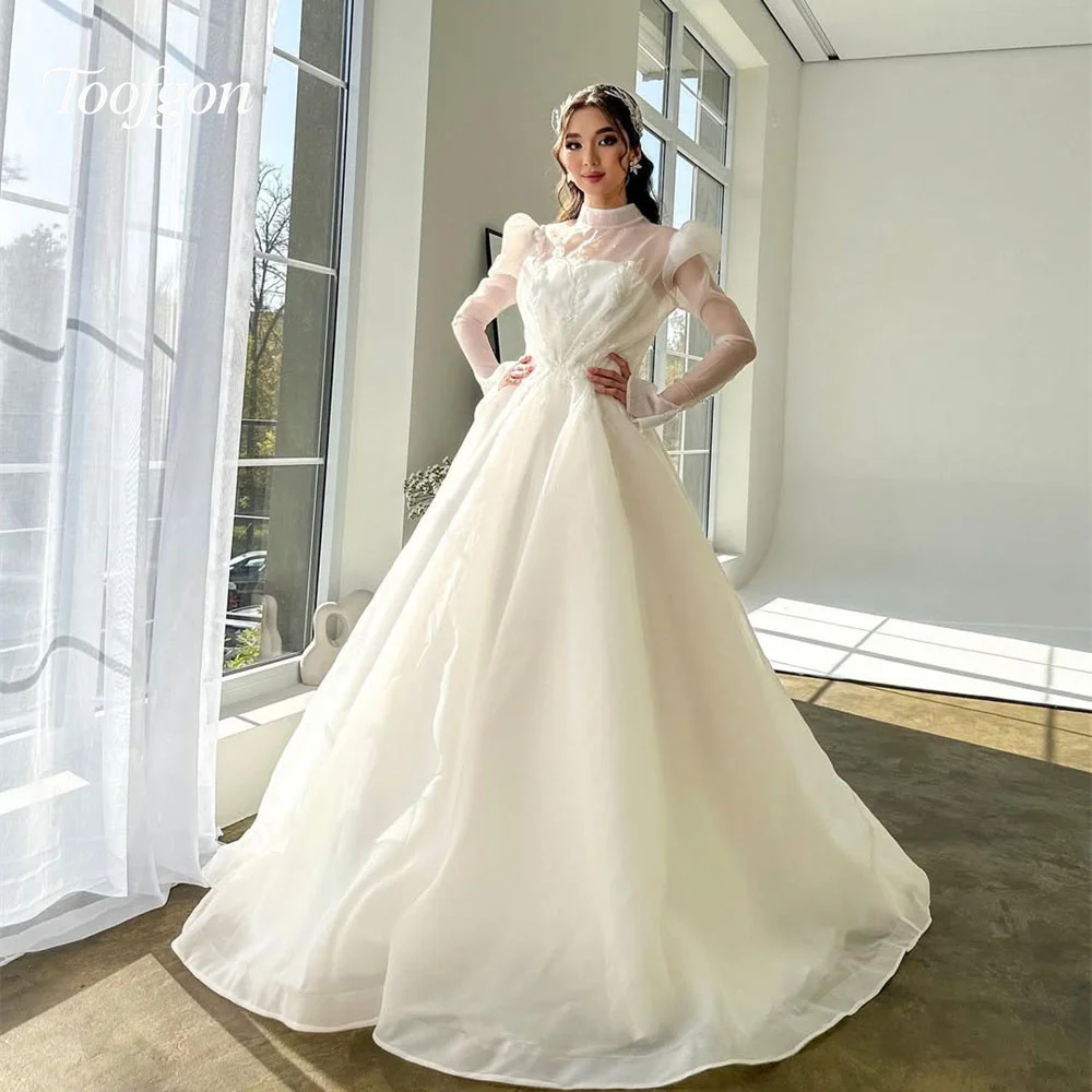 Toofgon High Neck Long Sleeves A Line Wedding Dresses Customized Organza Beaded Lace Appliques Bride Gown Muslim Party Dress
Toofgon High Neck Long Sleeves A Line Wedding Dresses Customized Organza Beaded Lace Appliques Bride Gown Muslim Party Dress