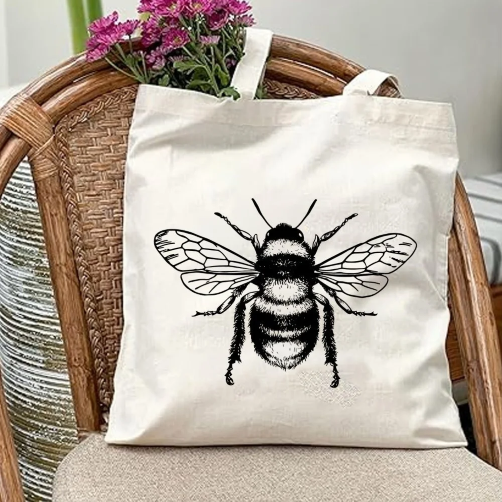 A Beautiful bee print canvas tote bag, suitable for daily use, shopping, school, and travel
A Beautiful bee print canvas tote bag, suitable for daily use, shopping, school, and travel