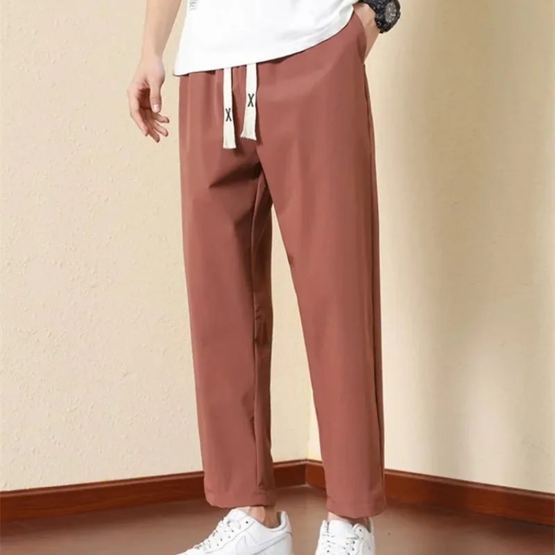 Men's Spring Summer Solid Pockets Drawstring Bandage Elastic High Waisted Casual Sports Small Leg Trousers Preppy Style Pants
Men's Spring Summer Solid Pockets Drawstring Bandage Elastic High Waisted Casual Sports Small Leg Trousers Preppy Style Pants
