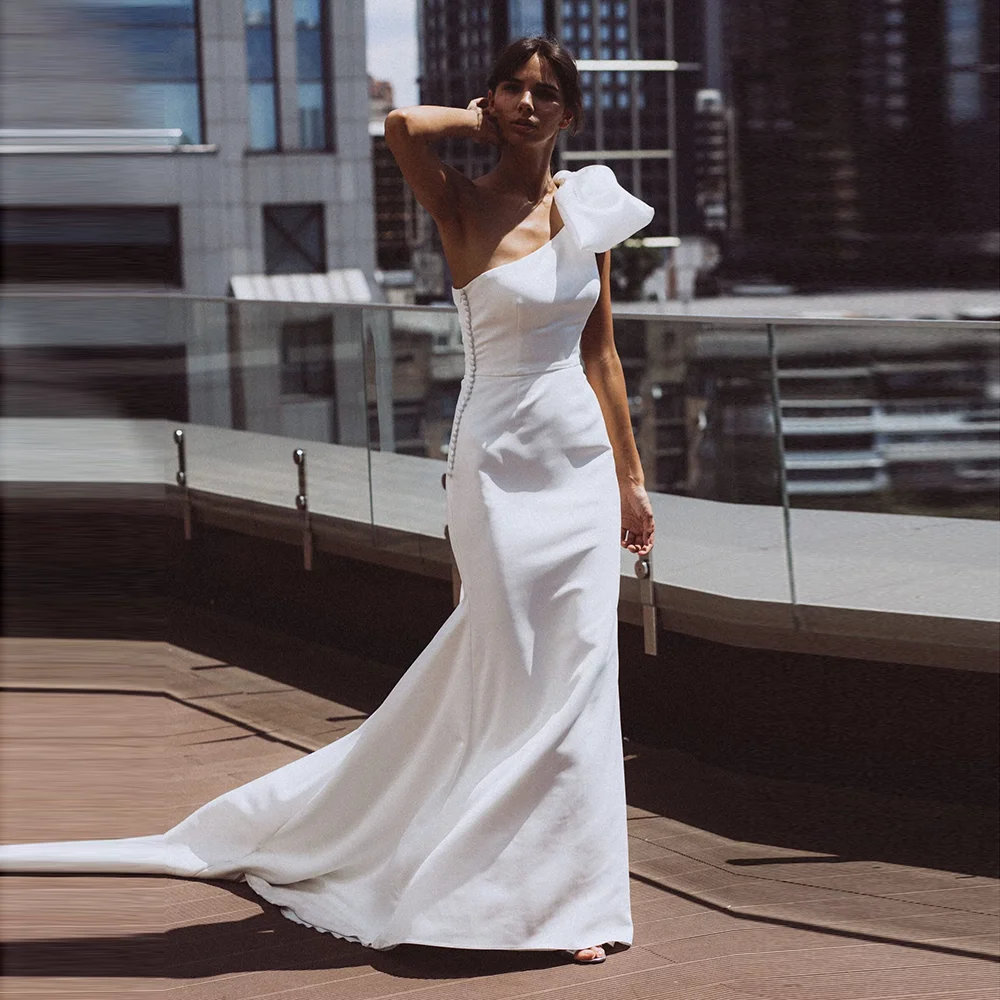 Customized Graceful One Shoulder Satin Sheath Backless Bridal Dress Bow Court Button Sleeveless Wedding Party Gown Vestidos De
Customized Graceful One Shoulder Satin Sheath Backless Bridal Dress Bow Court Button Sleeveless Wedding Party Gown Vestidos De
