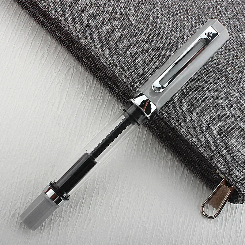 High Quality Capacity Piston Fountain Pen Plastic Transparent Silver Trim 0.38mm Nib Ink Pen Business Office School Supplies New
High Quality Capacity Piston Fountain Pen Plastic Transparent Silver Trim 0.38mm Nib Ink Pen Business Office School Supplies New