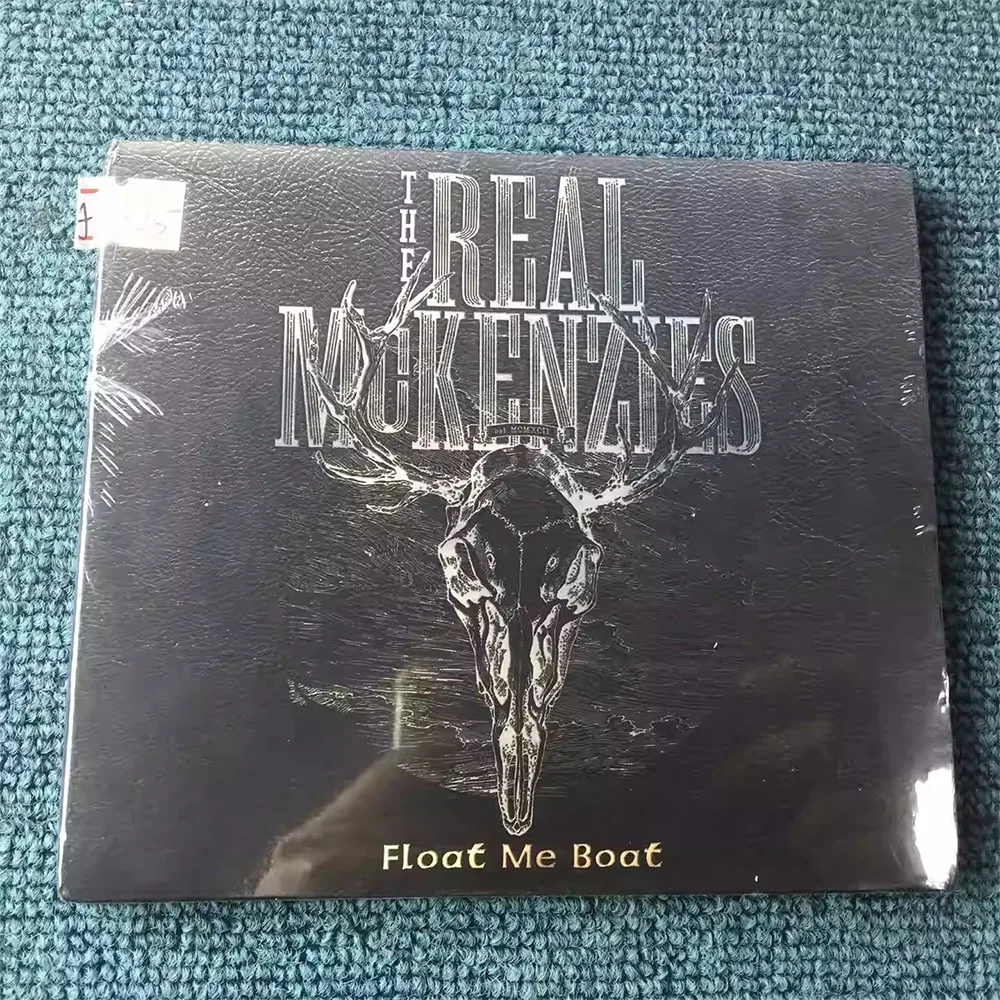 CD 'Float Me Boat' Is A Studio Album By Scottish Folk-rock Band The Real McKenzies. The Record Blends Celtic Punk, Folk Rock
CD 'Float Me Boat' Is A Studio Album By Scottish Folk-rock Band The Real McKenzies. The Record Blends Celtic Punk, Folk Rock
