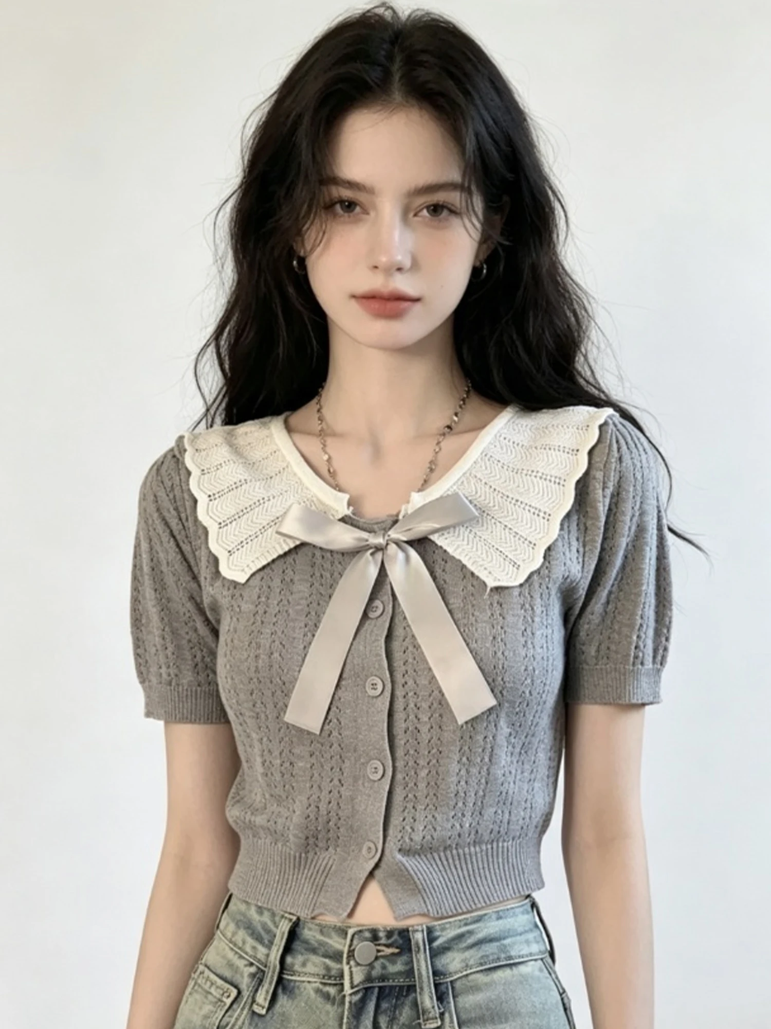 Women Grey Peter Pan Collar Sweater Hollow Out Short Sleeve Knit Cardigan Ruffle Lapel Preppy Style Cropped Knit Top Summer 2026
Women Grey Peter Pan Collar Sweater Hollow Out Short Sleeve Knit Cardigan Ruffle Lapel Preppy Style Cropped Knit Top Summer 2026