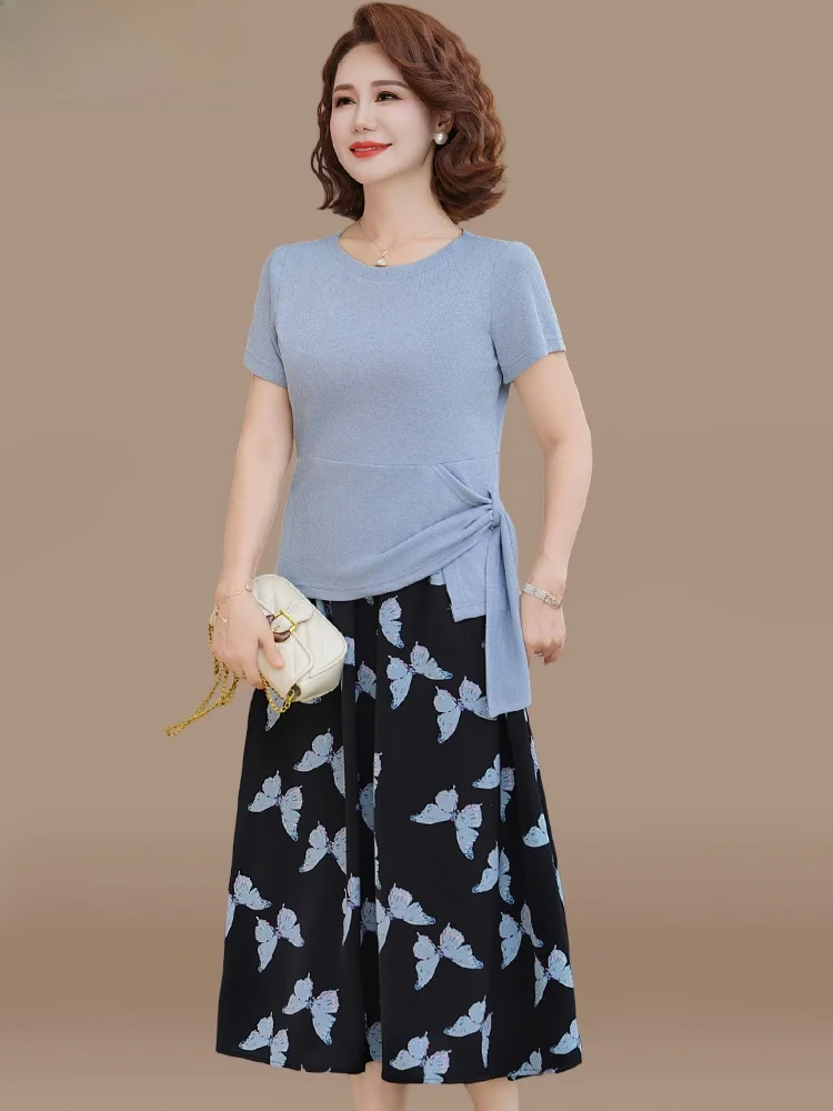 Летний комплект для женщин среднего возраста: модный свободный топ с коротким рукавом и юбка из полиэстера, футболка с круглым вырезом
Летний комплект для женщин среднего возраста: модный свободный топ с коротким рукавом и юбка из полиэстера, футболка с круглым вырезом