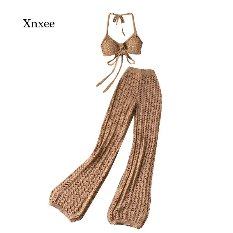 2022 Summer Women Solid Knitted Set Sexy Backless Halter Short Tops+Chic Hollow Knitted Wide Leg Long Pants Two Piece Suit
2022 Summer Women Solid Knitted Set Sexy Backless Halter Short Tops+Chic Hollow Knitted Wide Leg Long Pants Two Piece Suit