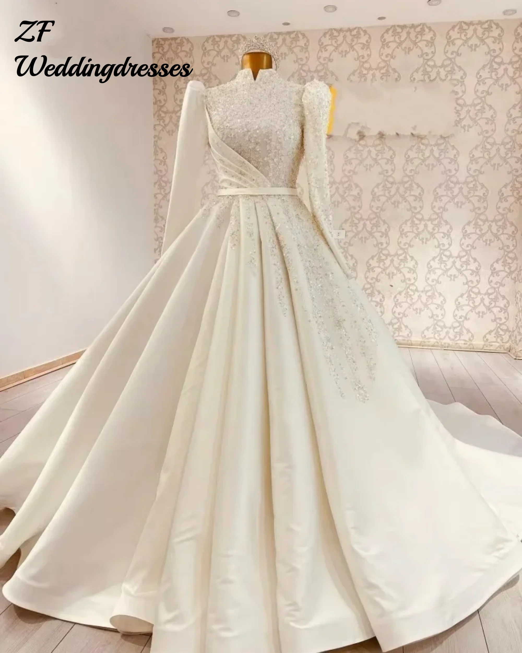 Скромные мусульманские свадебные платья по индивидуальному заказу для женщин, атласные свадебные платья цвета слоновой кости с блестками и бисером, трапециевидные свадебные платья с высоким воротом
Скромные мусульманские свадебные платья по индивидуальному заказу для женщин, атласные свадебные платья цвета слоновой кости с блестками и бисером, трапециевидные свадебные платья с высоким воротом