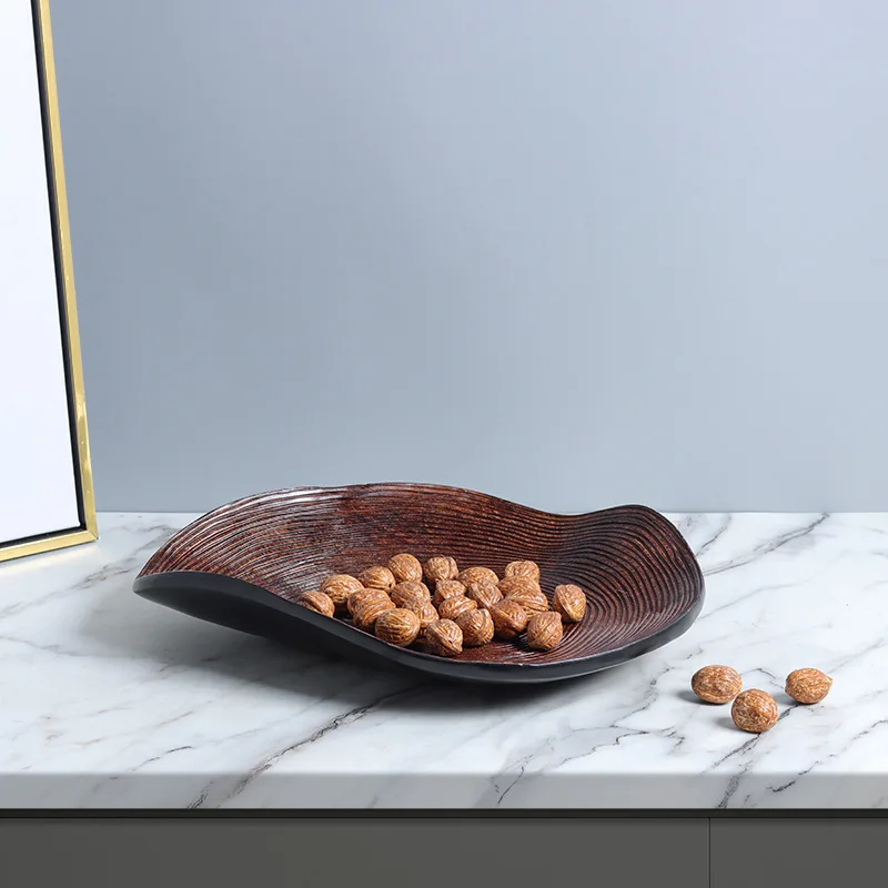 Modern Nordic silent wind old retro resin imitation wood line annual ring irregular oval fruit plate decoration
Modern Nordic silent wind old retro resin imitation wood line annual ring irregular oval fruit plate decoration