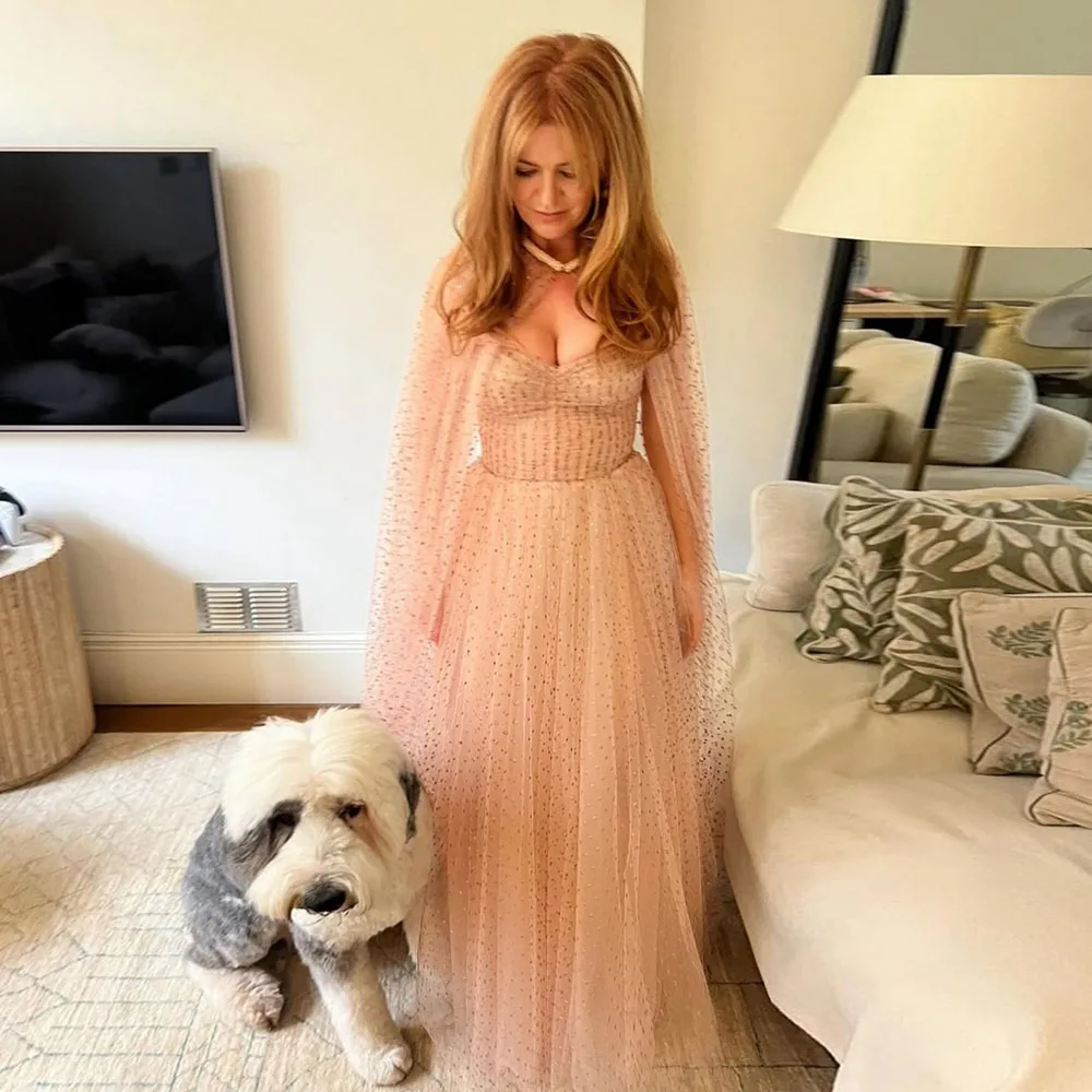 Graceful Peach Dress With Long Sleeves And Deep V Neckline Features Delicate Beading And Flowy Fabric Perfect For Formal Events
Graceful Peach Dress With Long Sleeves And Deep V Neckline Features Delicate Beading And Flowy Fabric Perfect For Formal Events