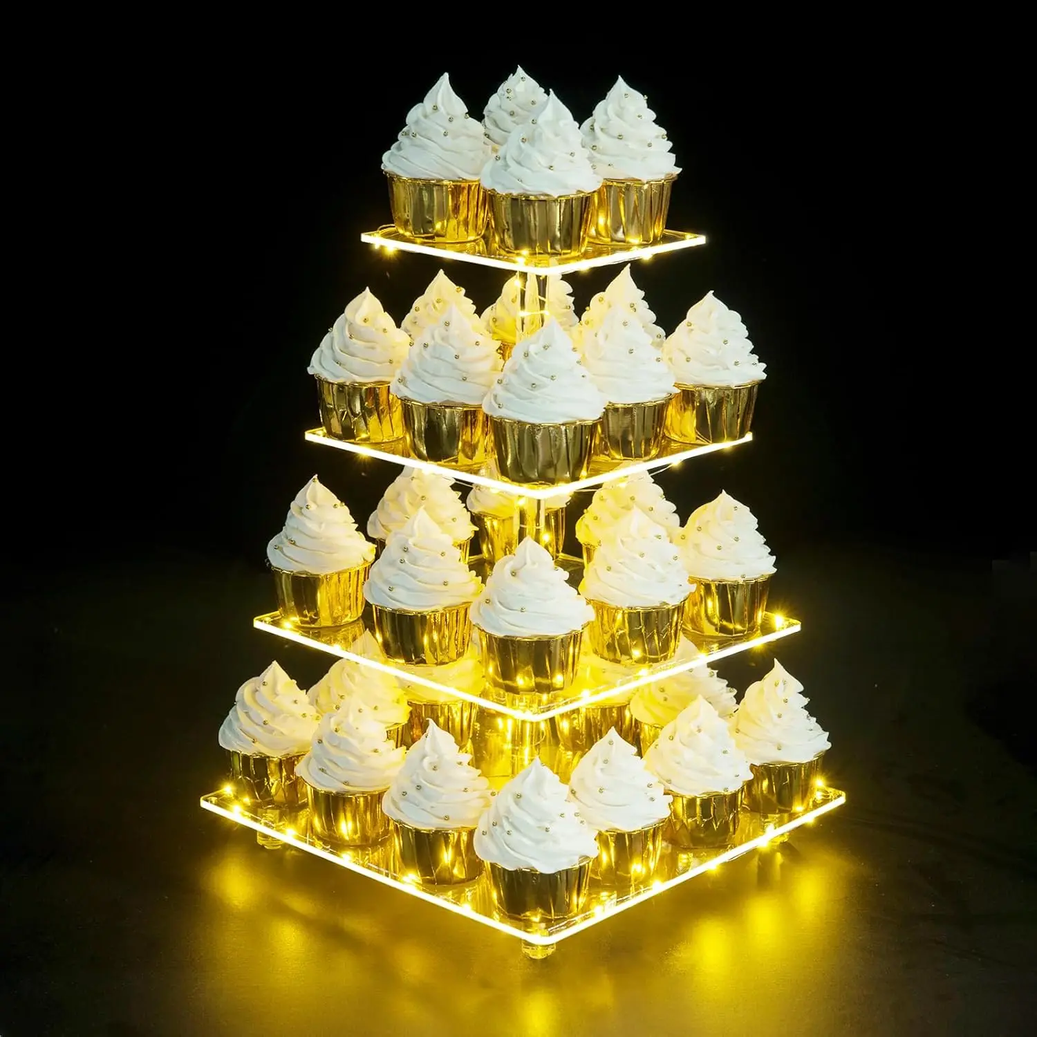 Transparent acrylic cupcake tower with bright yellow LED string lights, suitable for parties and other occasions.
Transparent acrylic cupcake tower with bright yellow LED string lights, suitable for parties and other occasions.