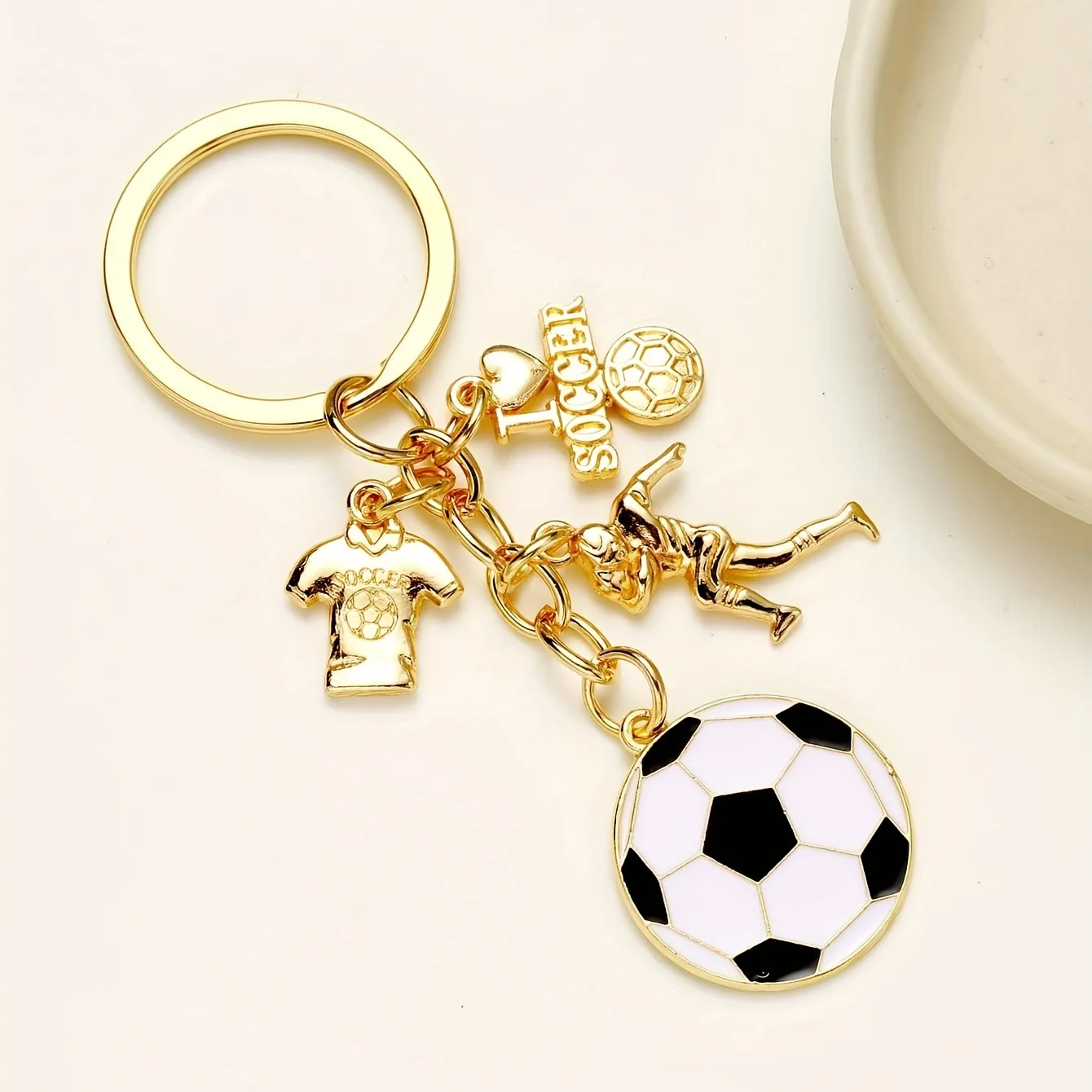 A Keychain Featuring a Soccer Player
A Keychain Featuring a Soccer Player