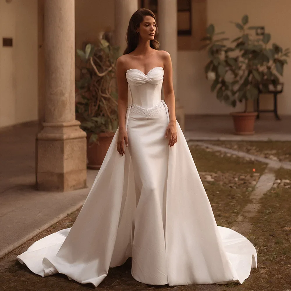 Элегантное свадебное платье невесты по индивидуальному заказу 2026, свадебное платье русалки без рукавов с жемчугом и скользящим шлейфом со съемным шлейфом
Элегантное свадебное платье невесты по индивидуальному заказу 2026, свадебное платье русалки без рукавов с жемчугом и скользящим шлейфом со съемным шлейфом