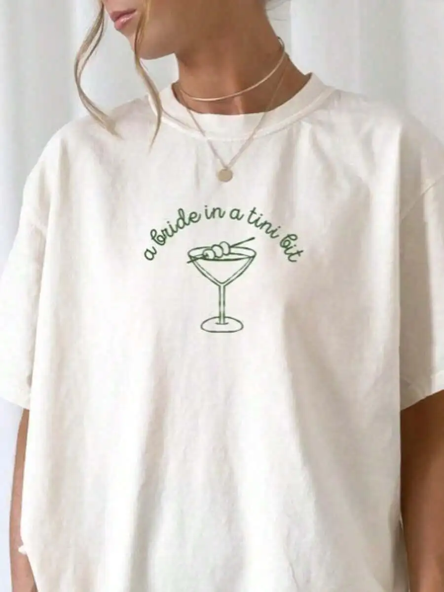 Womens Oversized Cotton T-Shirt Bride In A Tini Bit Martini Graphic Tee
Womens Oversized Cotton T-Shirt Bride In A Tini Bit Martini Graphic Tee
