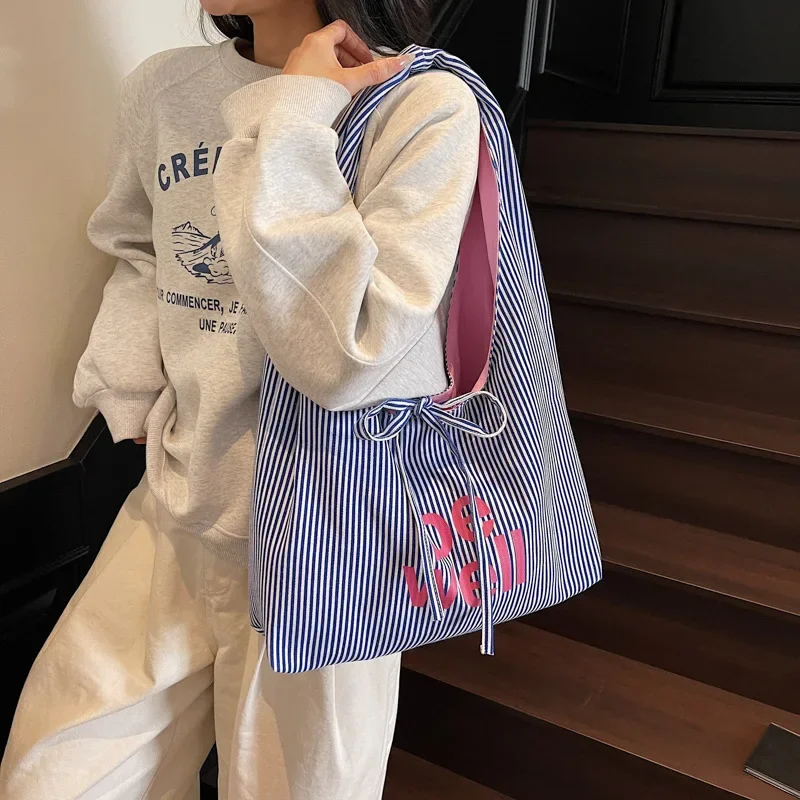 2025 Fashion Double - Sided Striped Canvas Tote - Large - Capacity Casual Shoulder Bag with Embroidered Texture for Commuters
2025 Fashion Double - Sided Striped Canvas Tote - Large - Capacity Casual Shoulder Bag with Embroidered Texture for Commuters