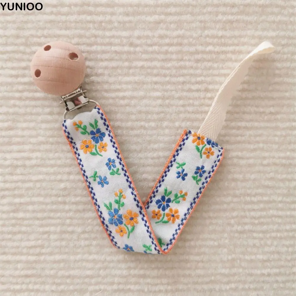Ethnic Style Baby Cloth Pacifier Chain Wood Embroidery Floral Soother Holder Adjustable Teether Toys Straps Nipple Holder Clips
Ethnic Style Baby Cloth Pacifier Chain Wood Embroidery Floral Soother Holder Adjustable Teether Toys Straps Nipple Holder Clips