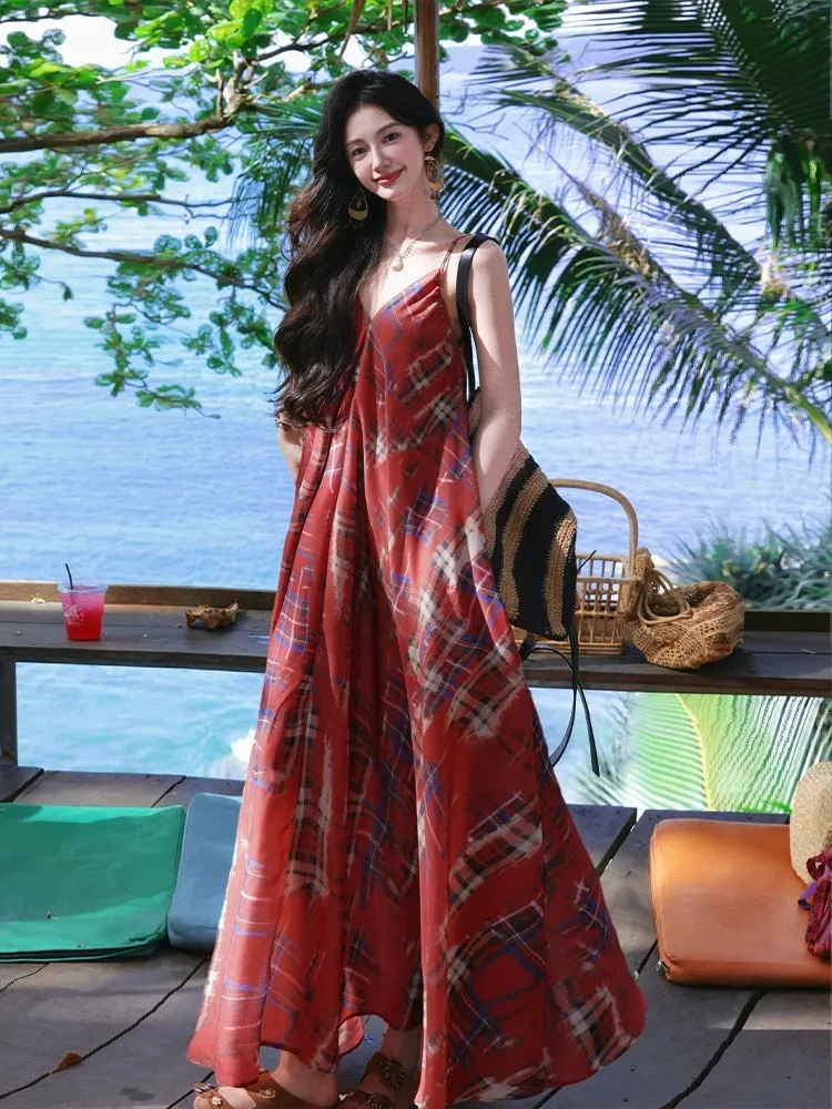 A unique and unconventional long dress with checkered halter design an irregular hem
A unique and unconventional long dress with checkered halter design an irregular hem