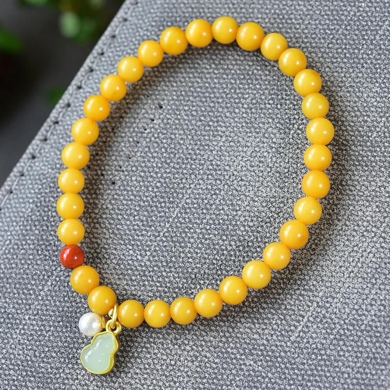 Natural Russian Chicken Fat Yellow Beeswax Single Circle Bracelet with Hetian Jade Gourd 5.6mm
Natural Russian Chicken Fat Yellow Beeswax Single Circle Bracelet with Hetian Jade Gourd 5.6mm