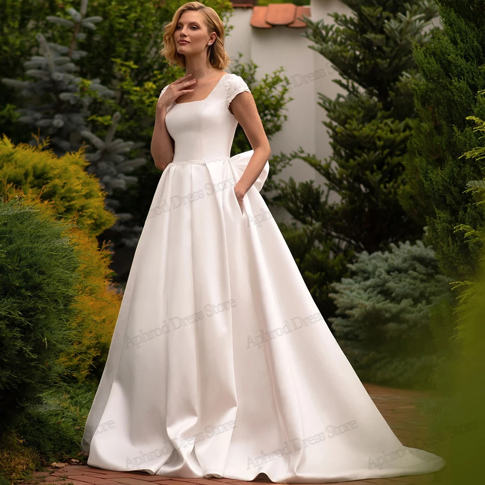 Классические свадебные платья трапециевидной формы, элегантные свадебные платья, простые халаты с квадратным воротником и бантом, Vestidos De Novia, по индивидуальному заказу, 2025 г.
Классические свадебные платья трапециевидной формы, элегантные свадебные платья, простые халаты с квадратным воротником и бантом, Vestidos De Novia, по индивидуальному заказу, 2025 г.