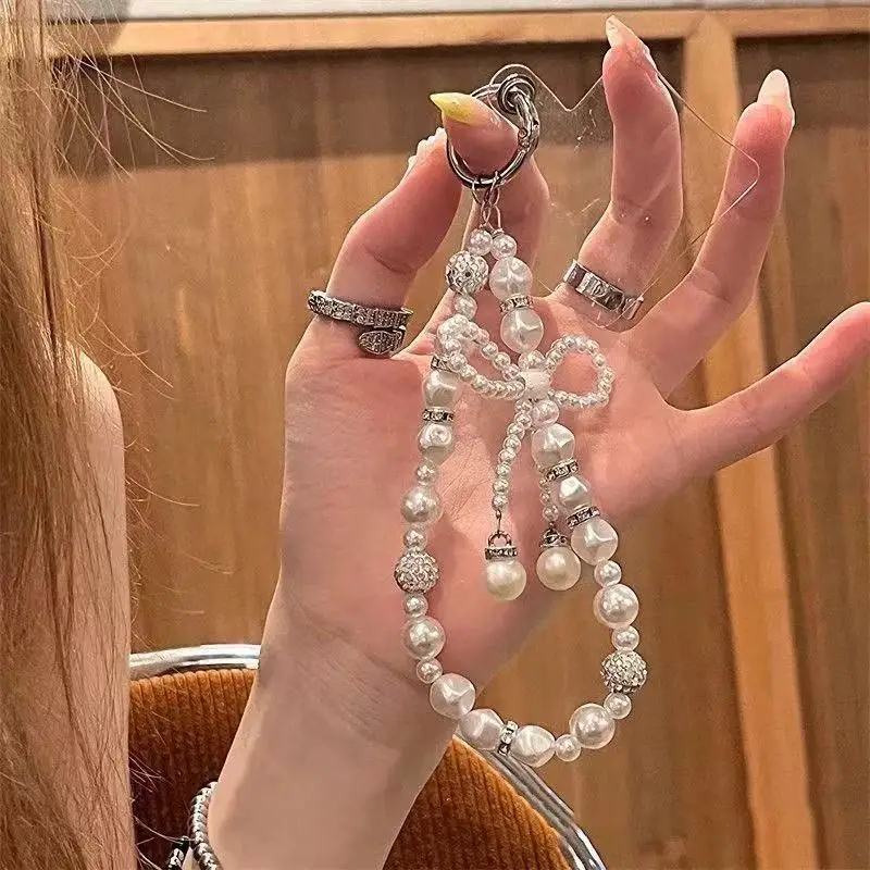 Luxury Pearl Bow Phone Charm with Rhinestone Beads, Elegant Anti-lost Wrist Strap for Phone & Bag
Luxury Pearl Bow Phone Charm with Rhinestone Beads, Elegant Anti-lost Wrist Strap for Phone & Bag