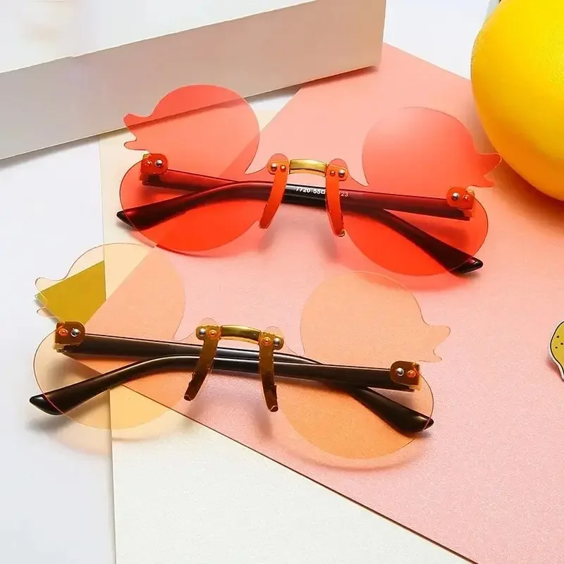 Stylish Cute Kids Sunglasses Rimless Cartoon Duck-Shaped Sunshade UV Protection Glasses Party Decoration Glasses For Kids
Stylish Cute Kids Sunglasses Rimless Cartoon Duck-Shaped Sunshade UV Protection Glasses Party Decoration Glasses For Kids