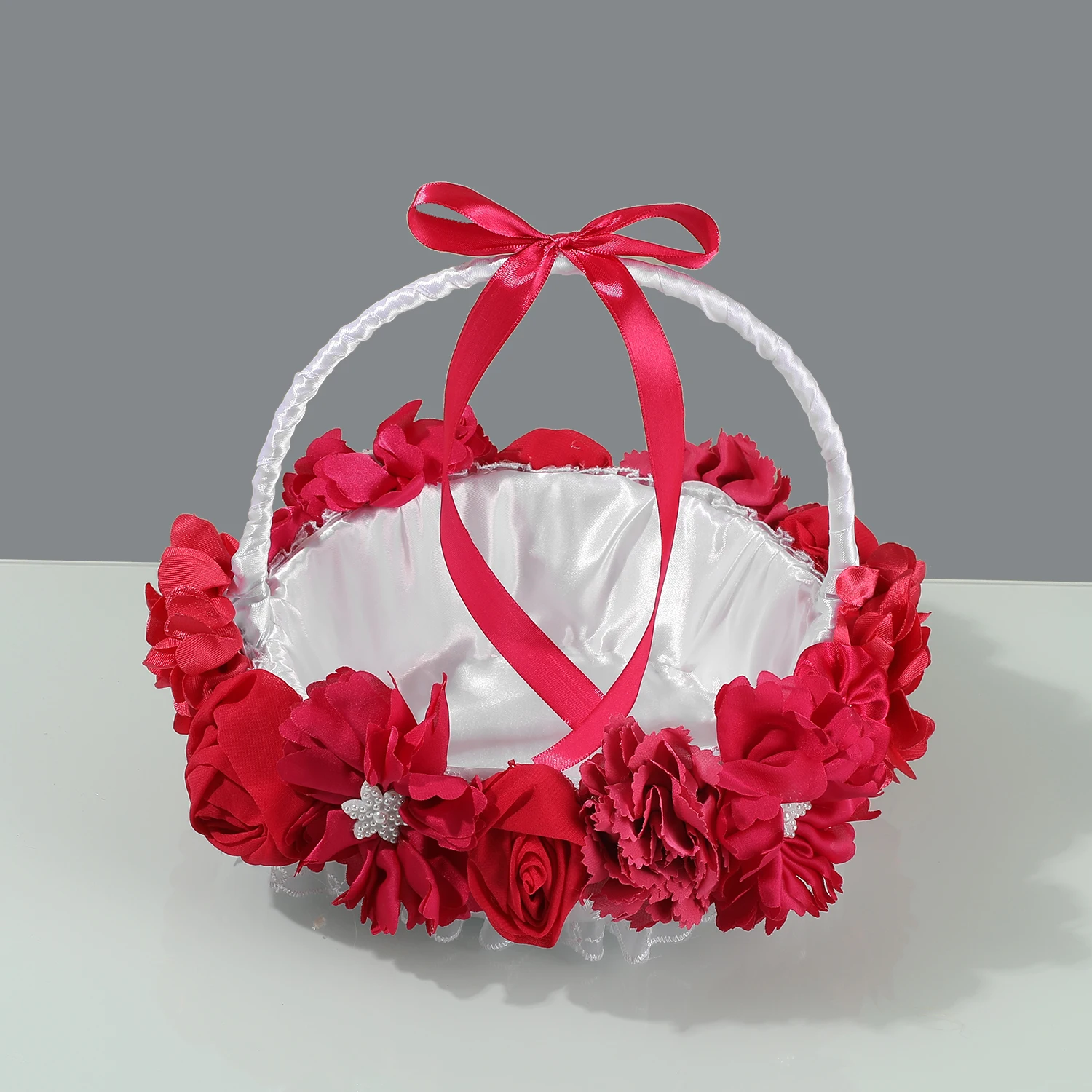 White Satin Flower Girl Basket with Red Fabric Floral Trim, Pearl Center Accents and Satin Handle Bow
White Satin Flower Girl Basket with Red Fabric Floral Trim, Pearl Center Accents and Satin Handle Bow