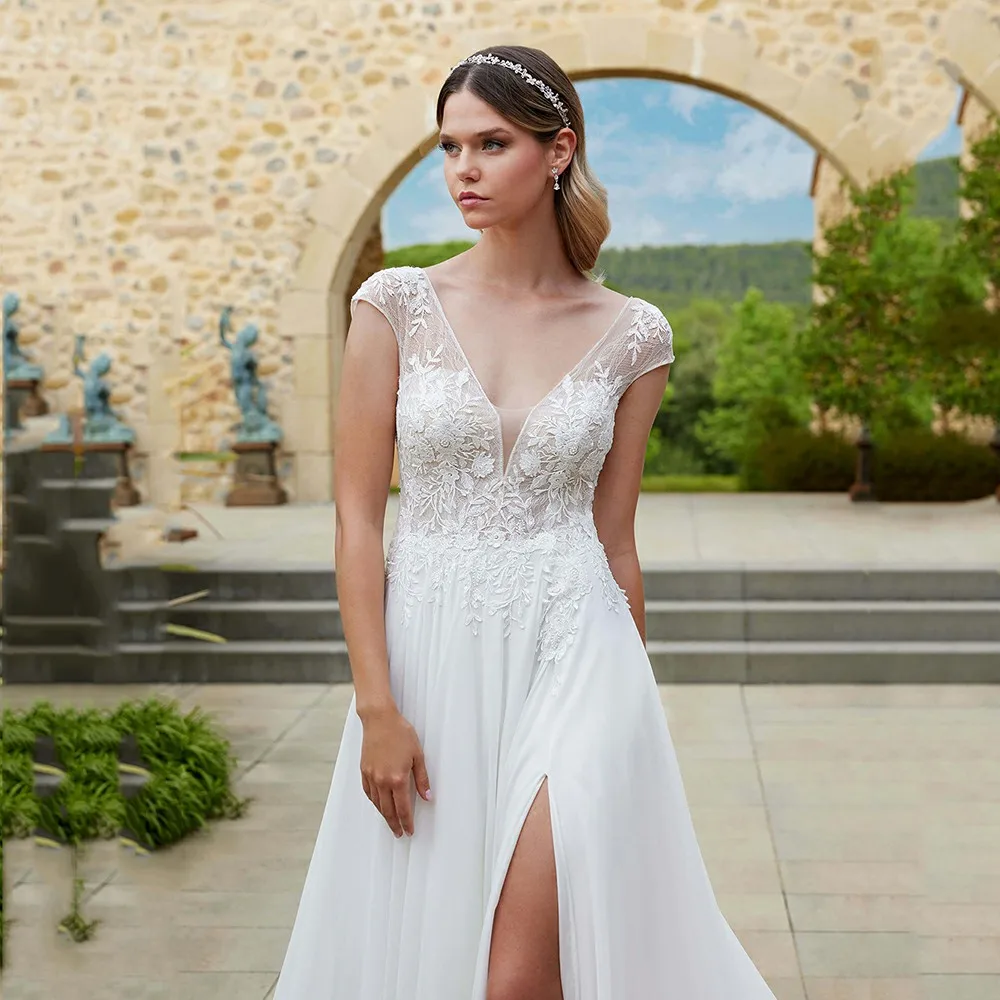 Boho Wedding Dresses Lace Appliques Illusion V Neck Cap Sleeve Backless Bridal Gown Slit Long Brides Dress Customized
Boho Wedding Dresses Lace Appliques Illusion V Neck Cap Sleeve Backless Bridal Gown Slit Long Brides Dress Customized